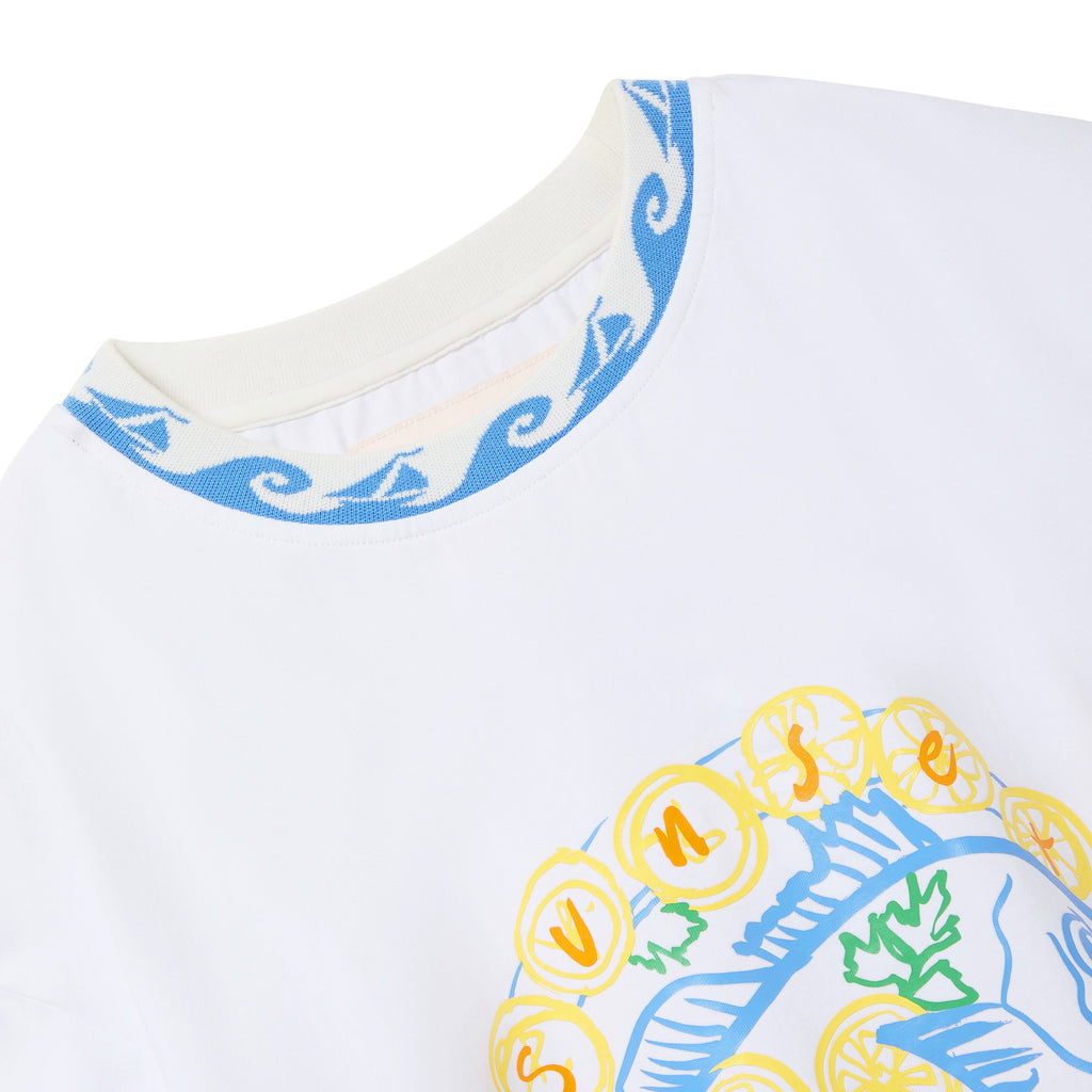 Close-up of a white shirt with colorful patterns on a white background