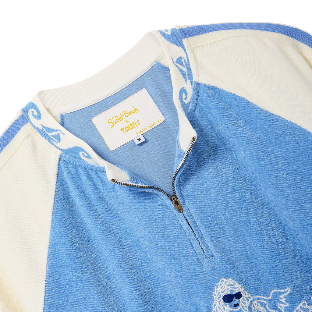 Close-up of a light blue and cream quarter-zip cabana shirt